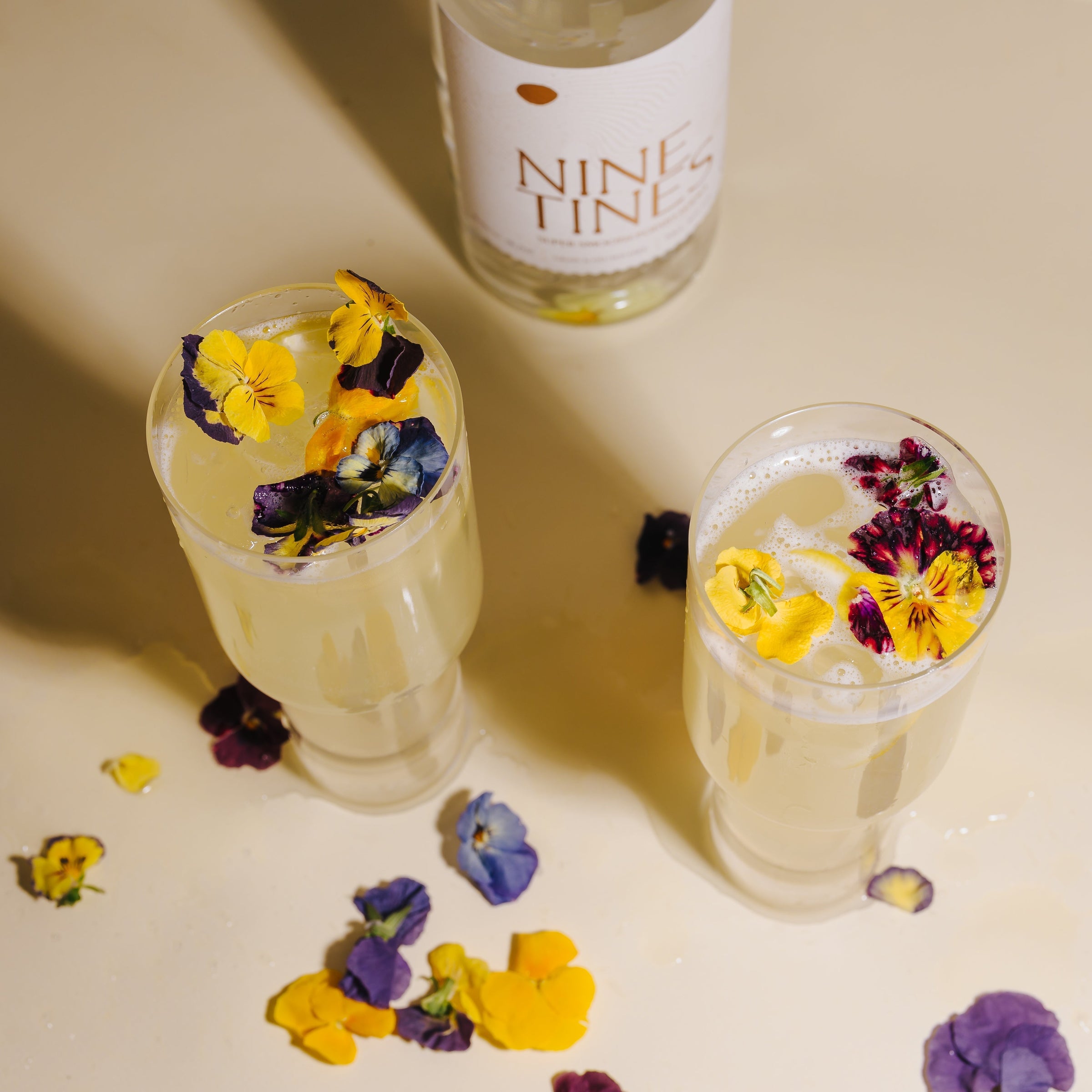 Nine Tines Elderflower Quencher summer serve with floral garnish