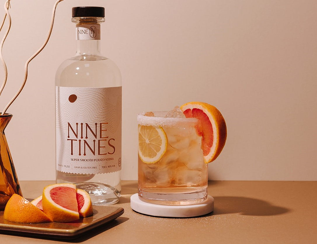 Nine Tines Citrus Sour served with a fresh citrus garnish