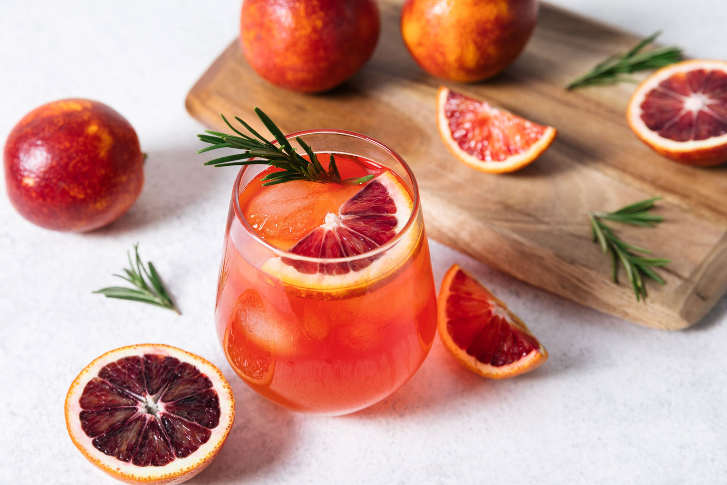 Nine Tines Blood Orange and Honey Sour cocktail served in rocks glass with citrus twist