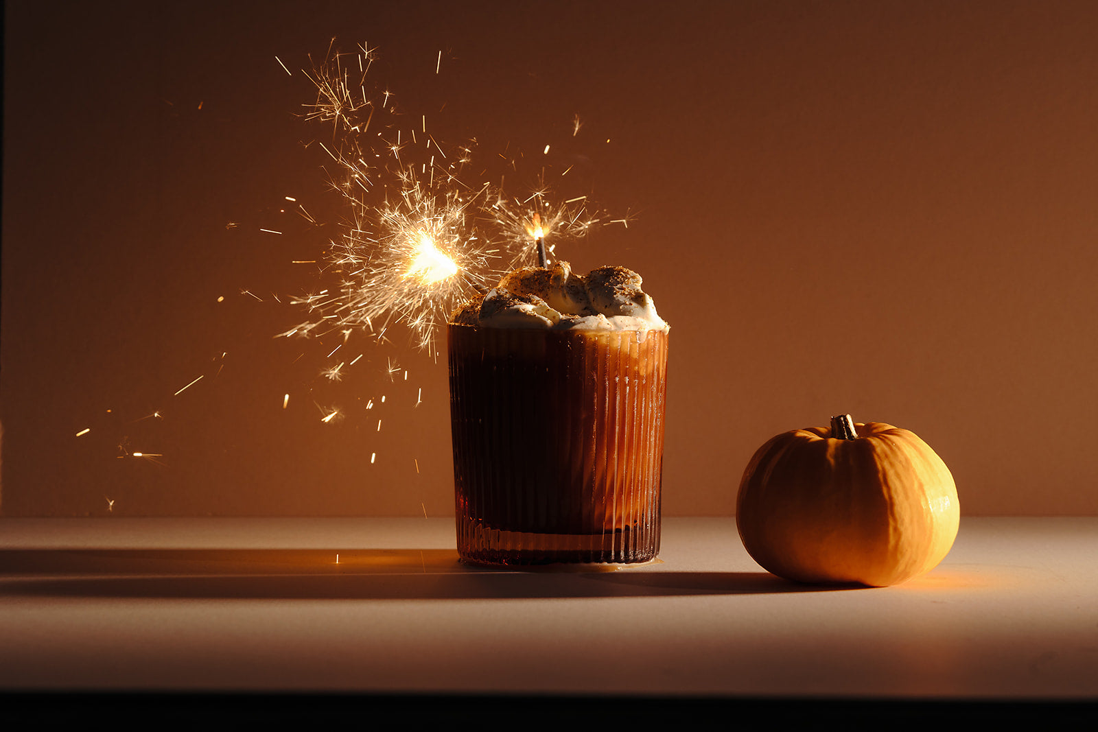 Nine Tines Pumpkin Spiced Latte topped with whipped cream and nutmeg