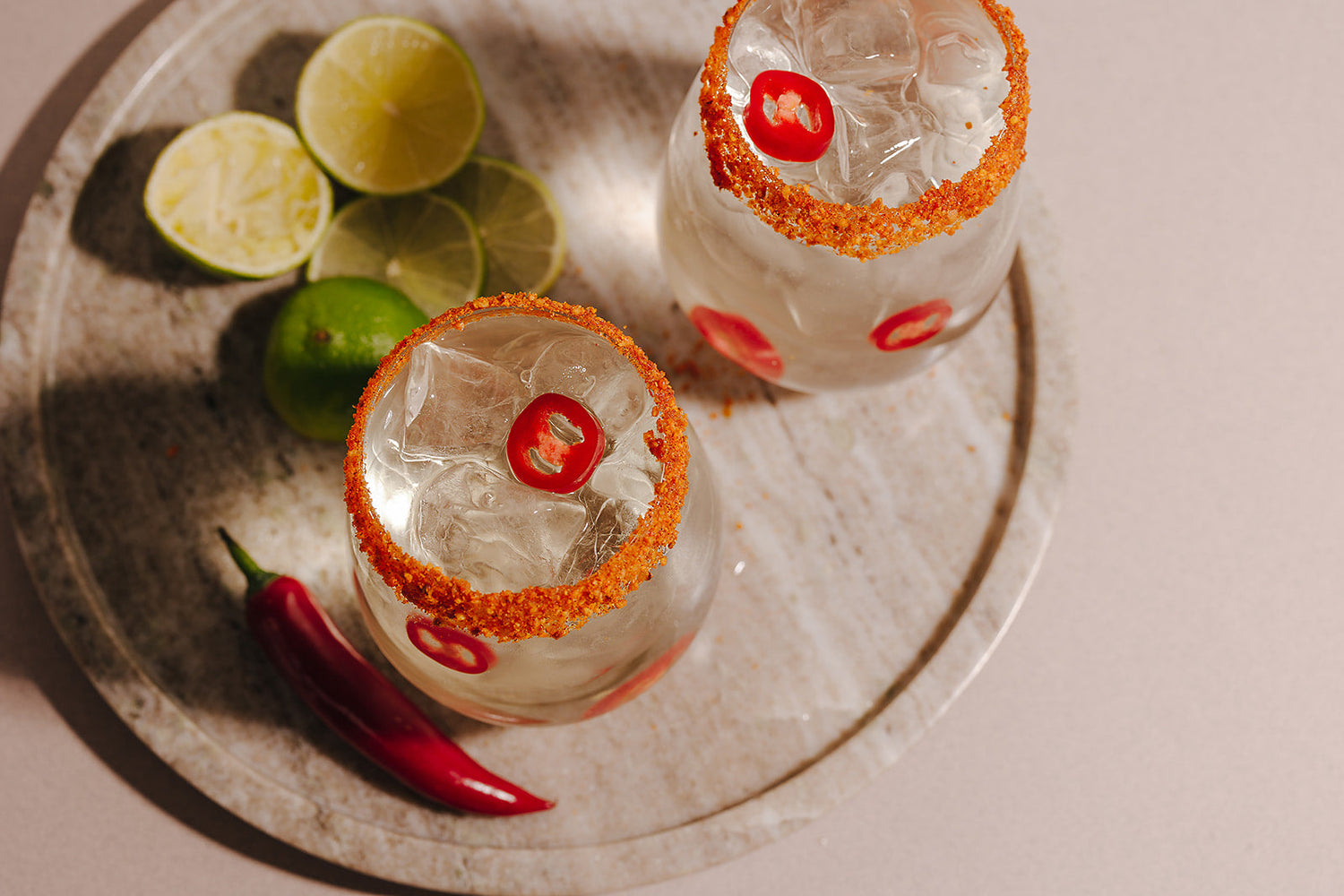 Jalapeño Margarita made with Nine Tines Potato Vodka in glass with jalapeño slices and salt rim