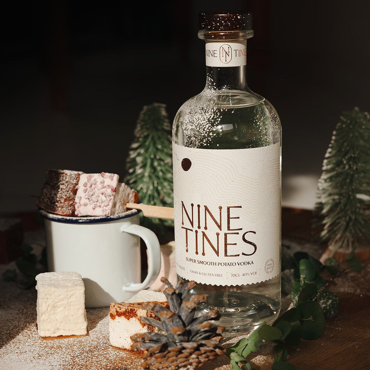 Nine Tines vodka bottle on a wooden surface with decorative elements